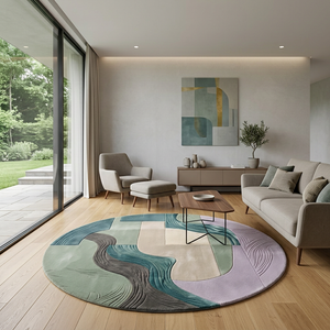 Meander round wool rug in a bright Scandinavian living room with oak floor and greige sofa