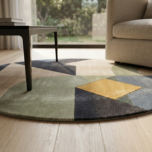 Close styling view of Quadra round wool rug in sage green, mustard and charcoal