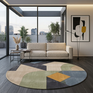 Quadra sage and mustard round wool rug under a beige sofa in a contemporary apartment