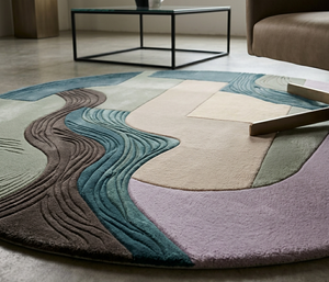 Hand-carved ridged texture detail along the teal channel on Meander wool rug